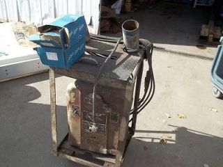 OLD Lincoln 180 Amp Welder w/Rolling Table & 50# of New Sealed Welding 