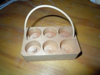 by 2 inch wooden milk crate with 6 wooden bottles
