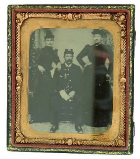 Tintype of a Soldier Sitting in Uniform with Two Ladies w/ Leather 