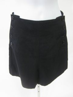 you are bidding on a agnes b black button down shorts in