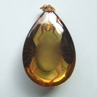   Maki e on the bulky clear amber and Opals and Diamonds are embedded