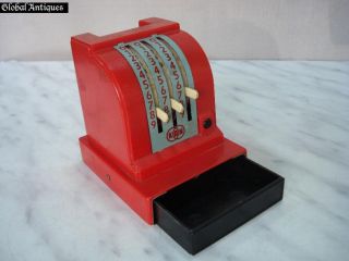 is this 1960s antique child’s toy money box  cash apparatus. The toy 