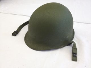   bidding on a world war ii us military soldier helmet with liner straps