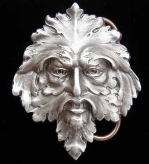 This detailed and highly unusual belt buckle depicts the Green Man of 