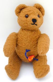 this charming little bear has the metal tag of clemens