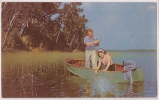  Michigan Postcard Couple in Fishing Boat   1951 East Tawas MI Postmark