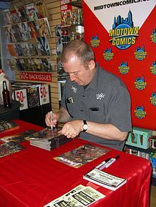 Writer Garth Ennis signing copies of Dynamite Entertainment s The