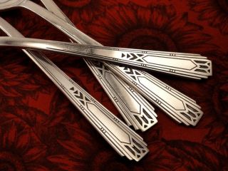 Set of 4 dinner forks measure 7 1/2 in length. Rare Art Deco pattern