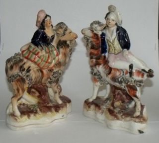 Pair of Victorian Staffordshire Goats with Boy Girl Atop