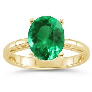 65 Cts of 7x5 mm AAA Oval Natural Emerald Scroll Ring in 14K Yellow