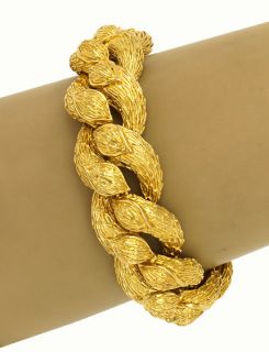 this is a vintage 18k gold ladies textured hefty bracelet the piece is