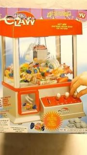 THE CLAW CRANE ELECTRONIC MUSICAL CANDY ARCADE TABLETOP GAME MACHINE