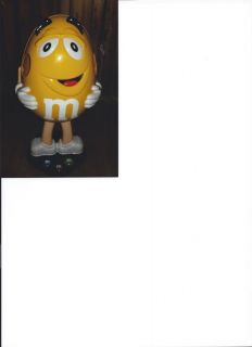 Yellow M M Store Display Character on Wheels